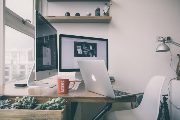office desk with desktop monitor keyboard